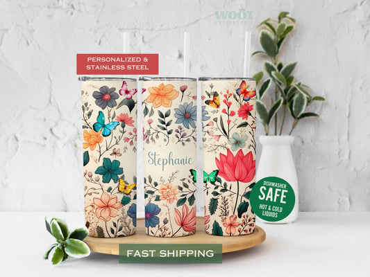 Three tumblers represent the rotating parts of a floral tumbler. There are a lot of spring flowers and butterflies. There are wildflowers and a space in the middle of the tumbler to add the name as a personalization.