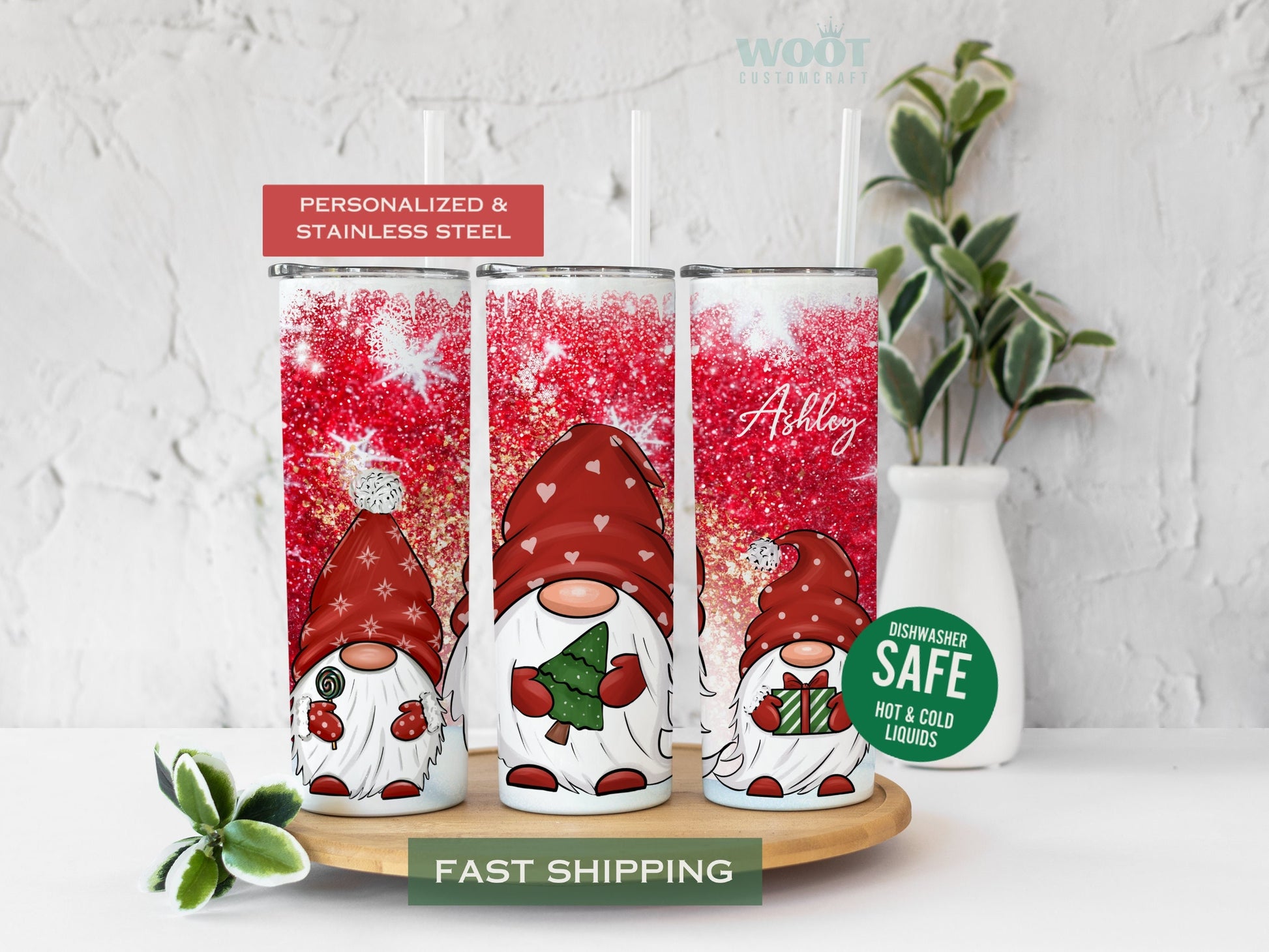 Three tumblers are showing all sides of a Merry Christmas Tumbler. Snowy scene with Snowflakes. Three gnomes and the personalized name in the top of the tumbler.