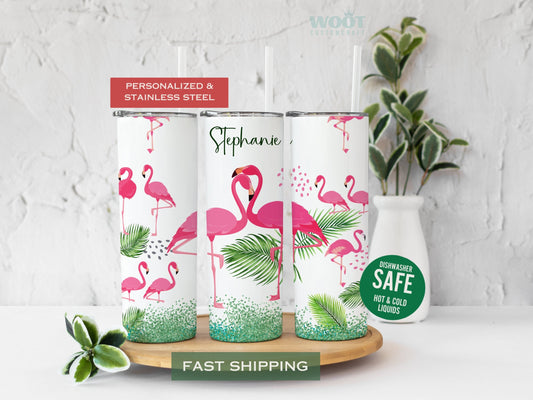 Three tumblers are showing all sides of a flamingo tumbler. Many flamingos are standing in a field with leaves, dancing on a tropical beach, swirling gardens, and a green glitter button. The mitten has a space for a personalized name on the tumbler.