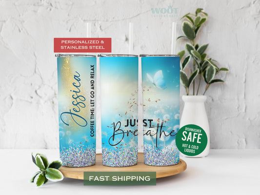 Three tumblers are showing all sides of a Just Breathe Tumbler. There is a text that says Just breathe; there are a lot of Dandelions, glitter, a butterfly, and a personalized name.