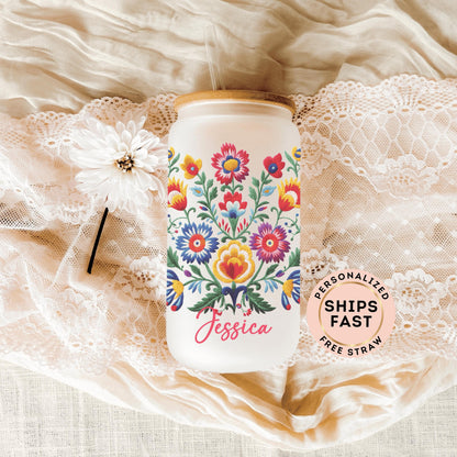 Mexican embroidery frosted glass cup featuring vibrant floral designs perfect for iced coffee or hot beverages