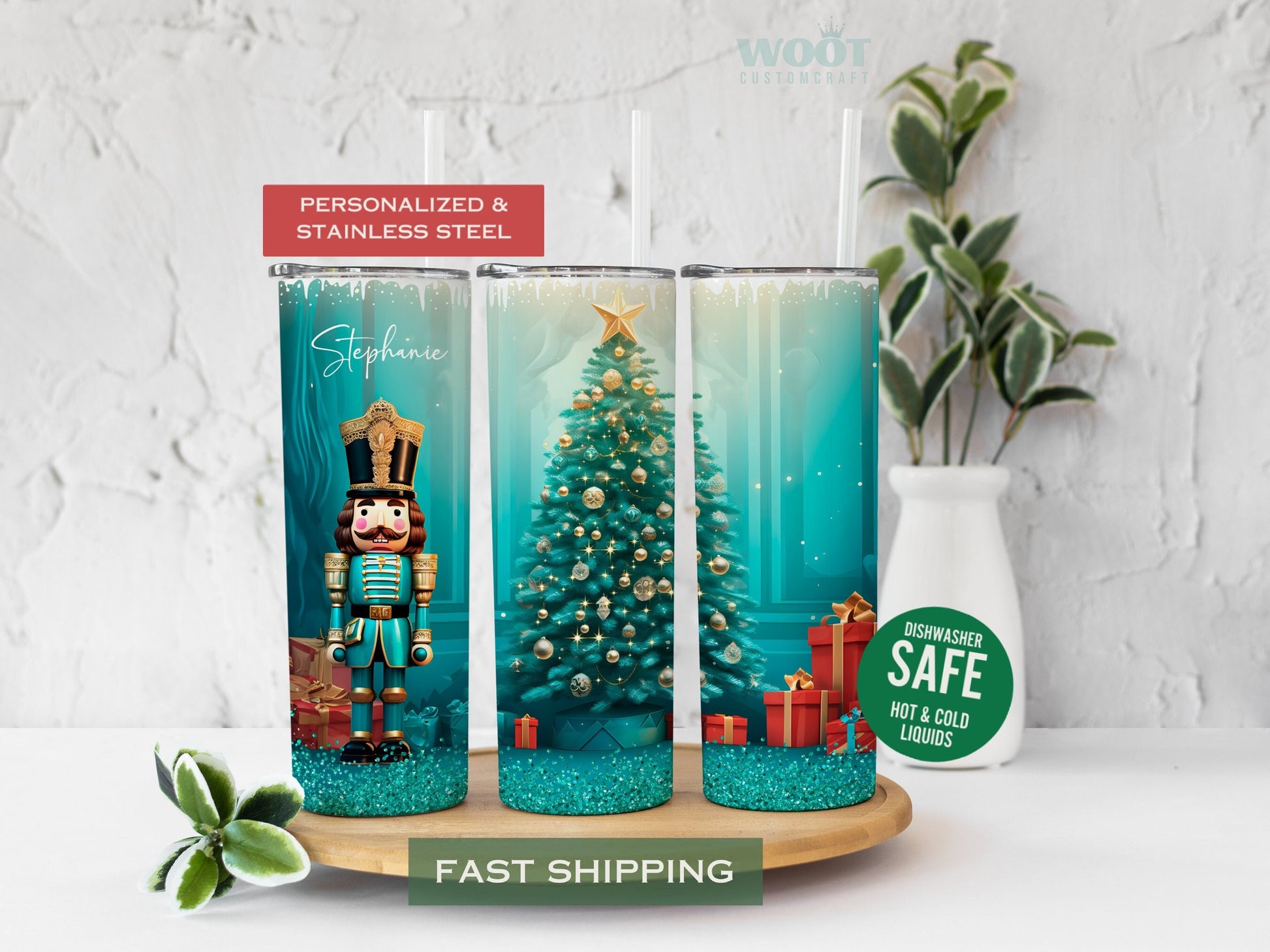 Three tumblers are showing all sides of a Christmas Holiday Tumbler. There is a Nutcracker and a Christmas tree, with Christmas packages and presents on the floor, turquoise glitter, and a personalized name on the top of the tumbler.