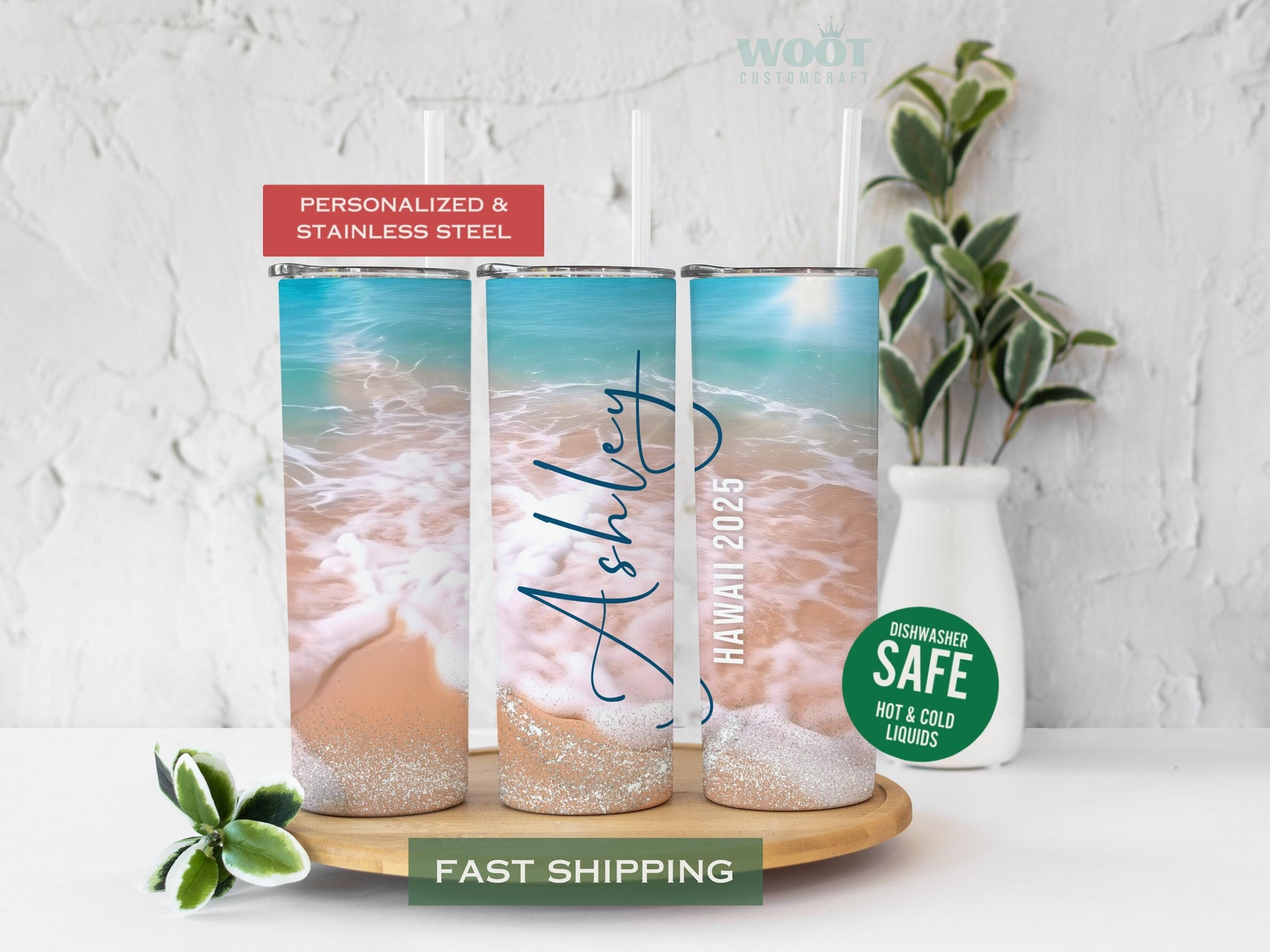 Three tumblers display various sides of a personalized beach vacation tumbler. There is a beach with waves on the sand, glitter, and details such as the name and year of the visited beach.